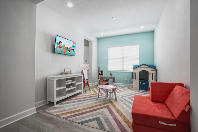 15581 Goldfinch Cir, The Acreage, FL 33470 - sitting room with wood finished floors, baseboards, and recessed lighting