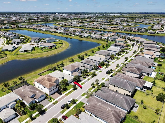 15581 Goldfinch Cir, The Acreage, FL 33470 - aerial perspective of suburban area featuring a large body of water