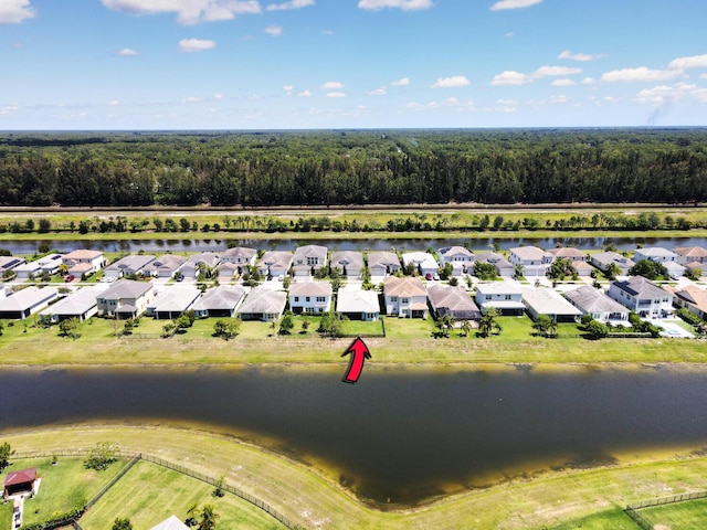 15581 Goldfinch Cir, The Acreage, FL 33470 - aerial perspective of suburban area with a nearby body of water and a heavily wooded area