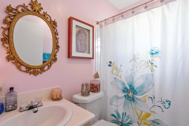 full bathroom featuring toilet and vanity