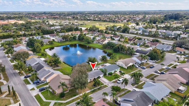 birds eye view of property featuring a residential view and a water view