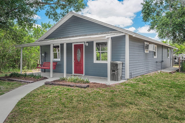 view of front of house featuring a front lawn and a porch