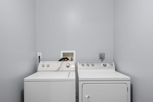 clothes washing area featuring laundry area and independent washer and dryer