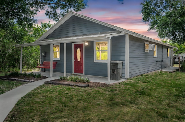 view of front facade with a front lawn and a porch