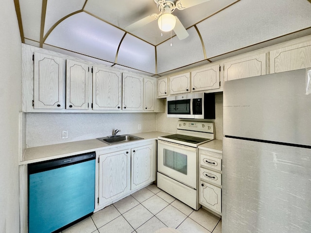 82 Dorset Unit B, Boca Raton, FL 33434 - kitchen with appliances with stainless steel finishes, light countertops, light tile patterned floors, and ceiling fan