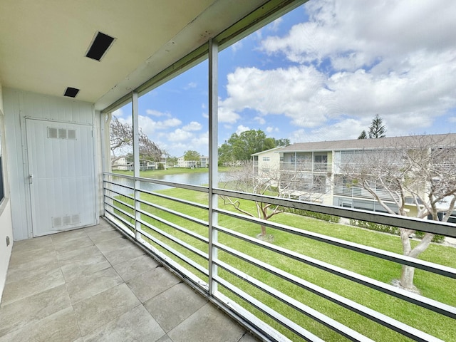 82 Dorset Unit B, Boca Raton, FL 33434 - unfurnished sunroom featuring a water view