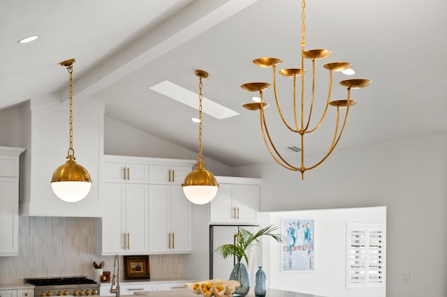 room details with decorative backsplash, range, beamed ceiling, light countertops, and a skylight