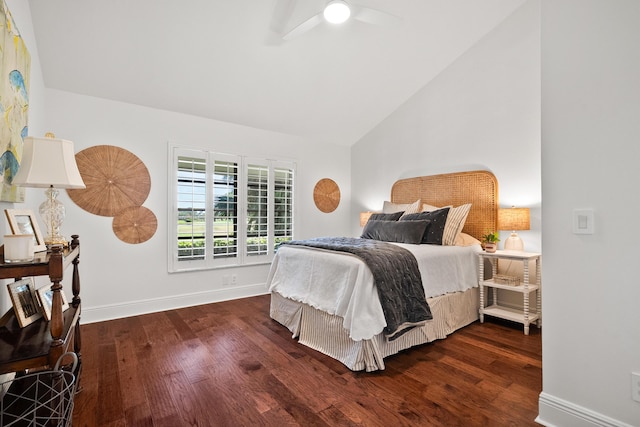 bedroom with dark wood finished floors, baseboards, ceiling fan, and high vaulted ceiling