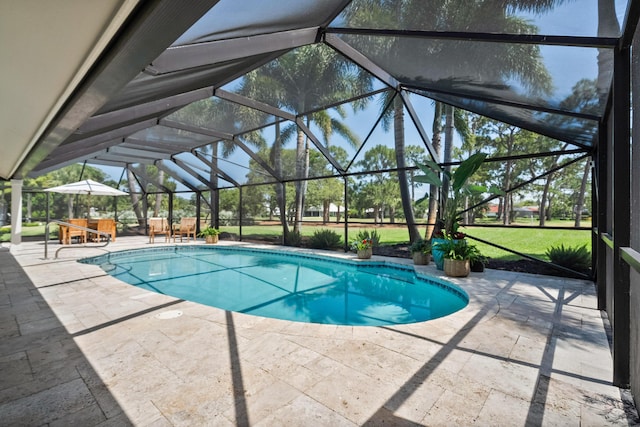 pool with a patio, a lanai, and outdoor dining space