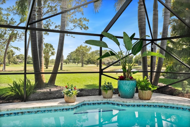 pool with a yard and view of golf course
