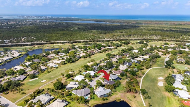 birds eye view of property featuring a residential view, a water view, and view of golf course