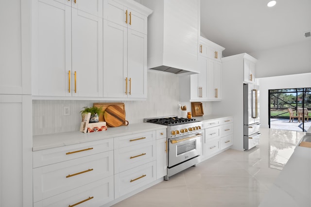 kitchen featuring white cabinetry, custom exhaust hood, light tile patterned flooring, recessed lighting, and high quality appliances