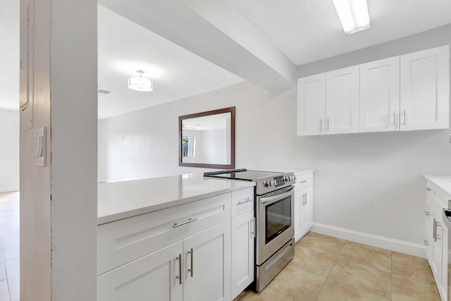 kitchen with white cabinetry, baseboards, stainless steel electric range oven, and light tile patterned flooring
