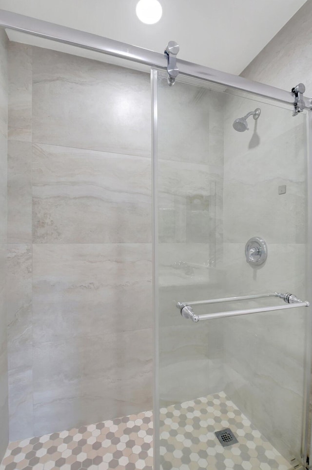 bathroom with a shower stall