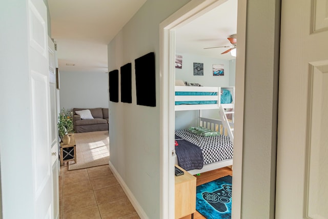 hall featuring light tile patterned floors
