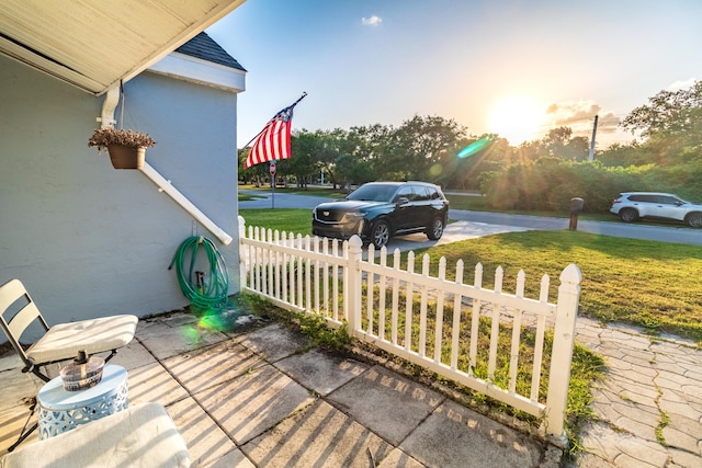 exterior space featuring fence and a yard