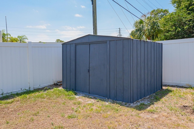 712 NE Camino St, Port Saint Lucie, FL 34952 - view of shed featuring fence