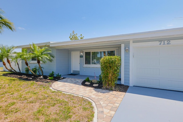 712 NE Camino St, Port Saint Lucie, FL 34952 - ranch-style house with an attached garage