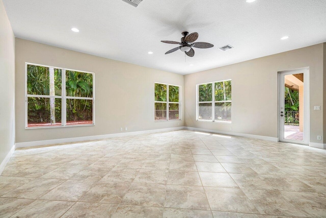 unfurnished room featuring a textured ceiling, visible vents, ceiling fan, baseboards, and recessed lighting