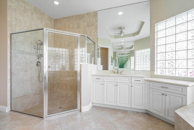 full bath with recessed lighting, tile patterned flooring, a shower stall, ceiling fan, and vanity