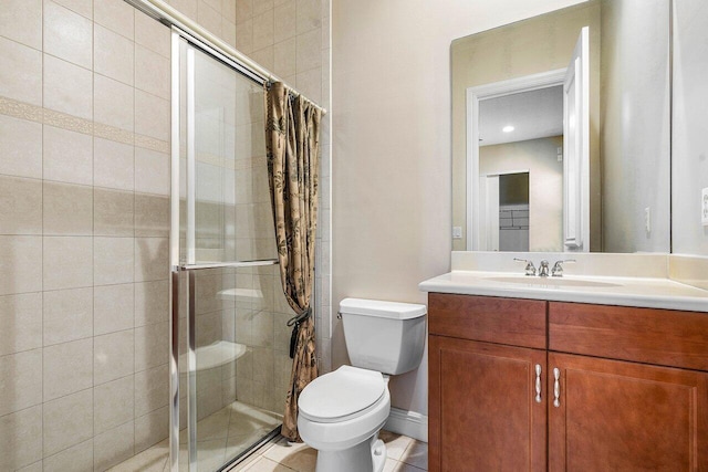 bathroom featuring toilet, vanity, a shower stall, and tile patterned flooring
