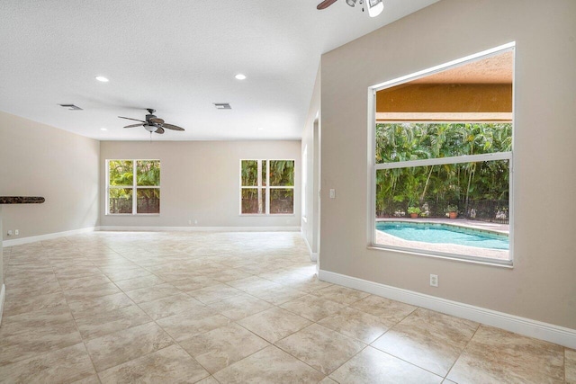 unfurnished room featuring recessed lighting, a ceiling fan, visible vents, and baseboards