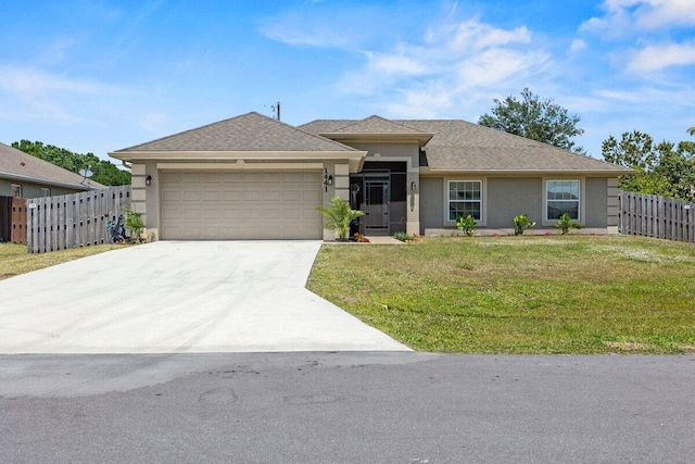 ranch-style house with a front yard, stucco siding, driveway, an attached garage, and fence