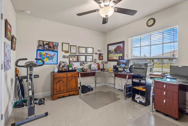 office with a ceiling fan and baseboards