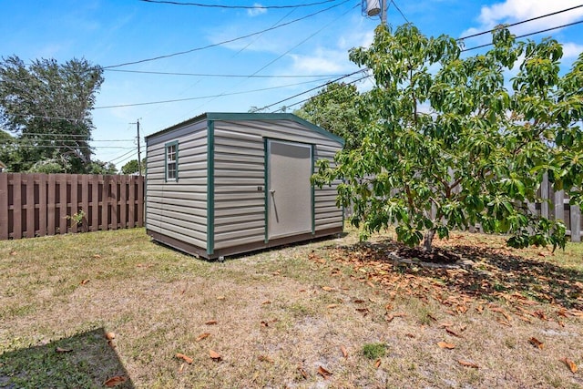 view of shed with a fenced backyard