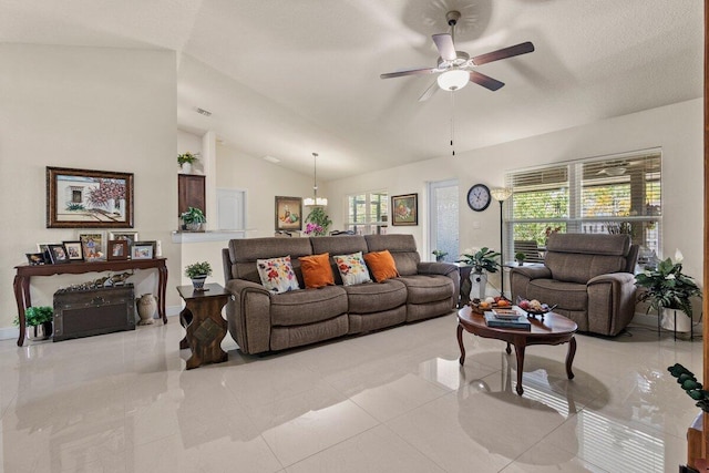 living room featuring ceiling fan and vaulted ceiling