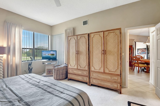 7460 La Paz Blvd Unit 206, Boca Raton, FL 33433 - bedroom featuring visible vents, a ceiling fan, and light carpet