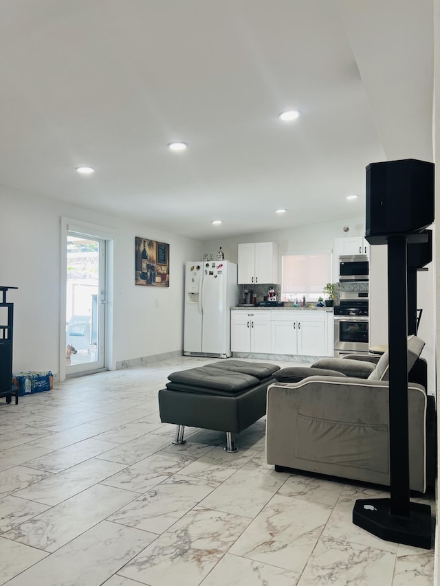 4730 W 8th Pl, Hialeah, FL 33012 - living room with recessed lighting and marble finish floor