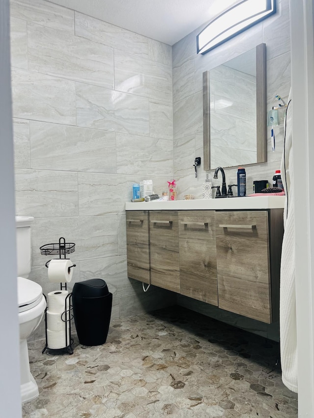 4730 W 8th Pl, Hialeah, FL 33012 - bathroom with toilet, tile walls, and vanity