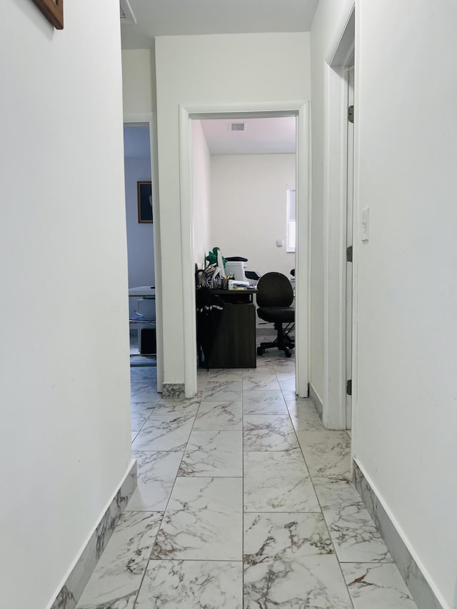 4730 W 8th Pl, Hialeah, FL 33012 - hallway with baseboards, visible vents, and marble finish floor