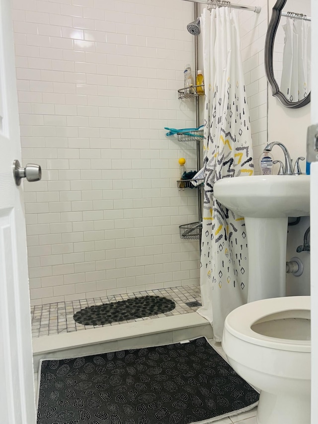 4730 W 8th Pl, Hialeah, FL 33012 - bathroom featuring a stall shower and toilet