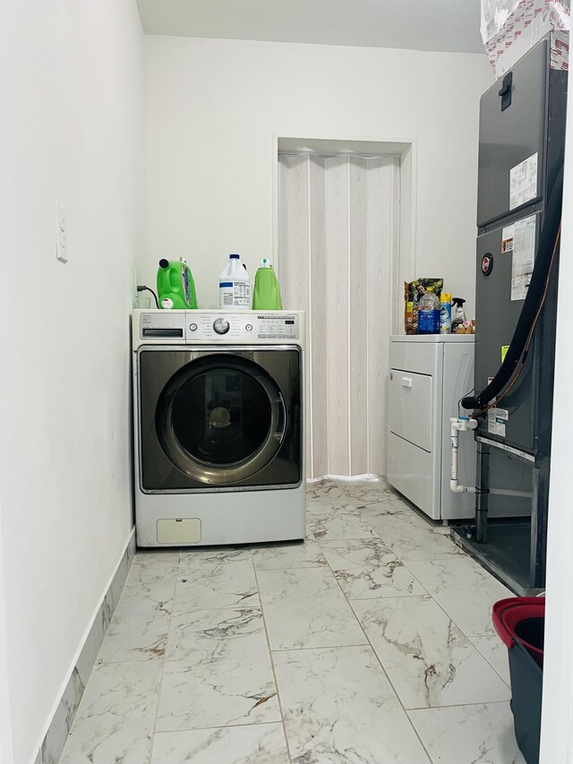 4730 W 8th Pl, Hialeah, FL 33012 - laundry area with baseboards, laundry area, washer / clothes dryer, and marble finish floor