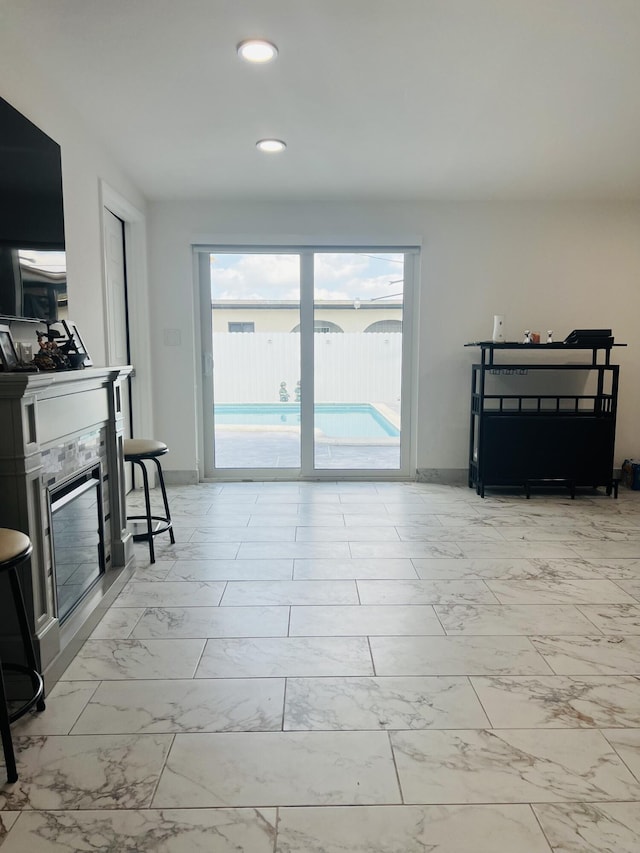 4730 W 8th Pl, Hialeah, FL 33012 - living area featuring baseboards, recessed lighting, and marble finish floor