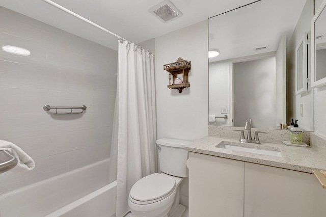 bathroom featuring visible vents, toilet, vanity, and shower / tub combo with curtain