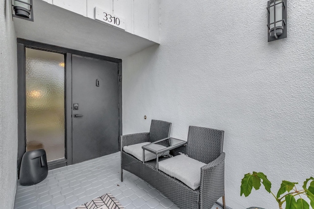 doorway to property with stucco siding