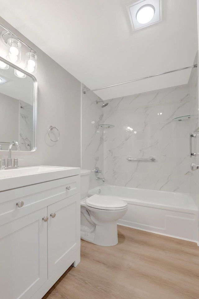 296 Fanshaw H, Boca Raton, FL 33434 - bathroom with wood finished floors,  shower combination, vanity, and toilet