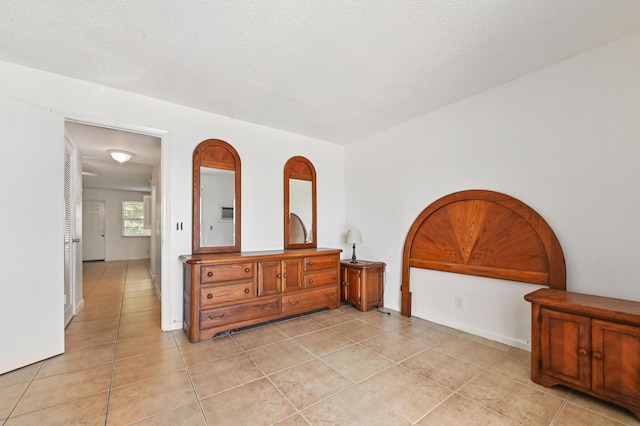 bedroom featuring light tile patterned floors