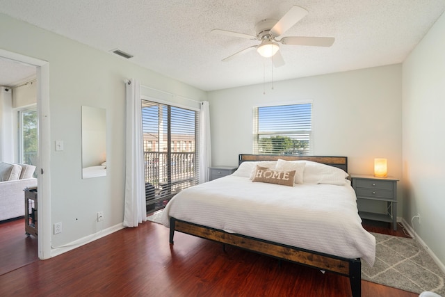 236 Castlewood Dr Unit 301, North Palm Beach, FL 33408 - bedroom with access to outside, visible vents, baseboards, a textured ceiling, and wood finished floors