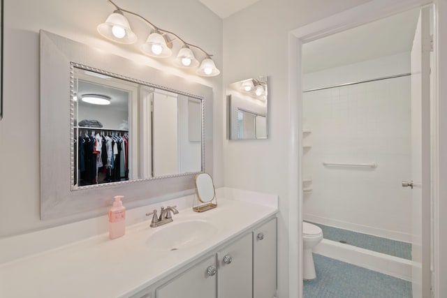 236 Castlewood Dr Unit 301, North Palm Beach, FL 33408 - full bathroom with vanity, toilet, and a tile shower