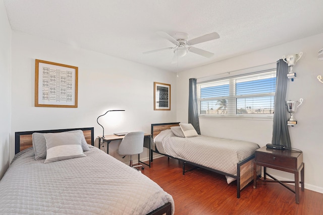 236 Castlewood Dr Unit 301, North Palm Beach, FL 33408 - bedroom featuring baseboards, wood finished floors, and ceiling fan