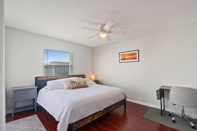 236 Castlewood Dr Unit 301, North Palm Beach, FL 33408 - bedroom featuring a textured ceiling, ceiling fan, wood finished floors, and baseboards