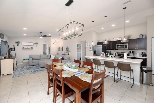 dining room featuring visible vents, light tile patterned floors, ceiling fan with notable chandelier, and recessed lighting