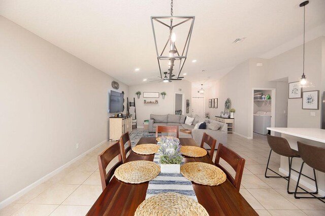 dining space with recessed lighting, an inviting chandelier, vaulted ceiling, baseboards, and light tile patterned flooring