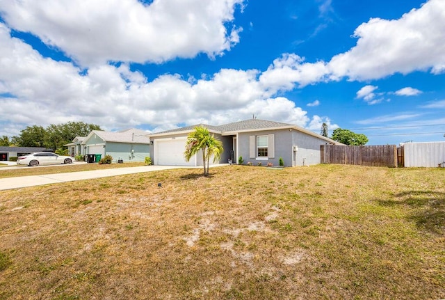 ranch-style home with driveway, fence, a front yard, and a garage