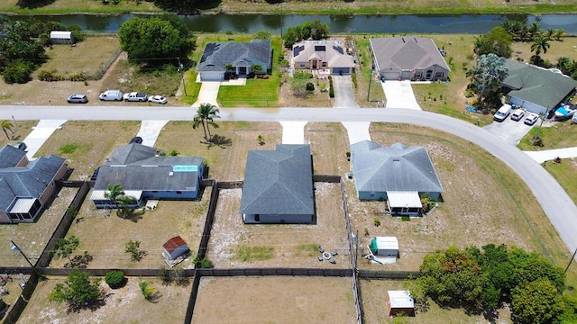 aerial view featuring a water view and a residential view