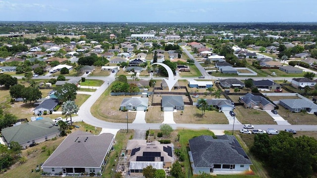 birds eye view of property with a residential view